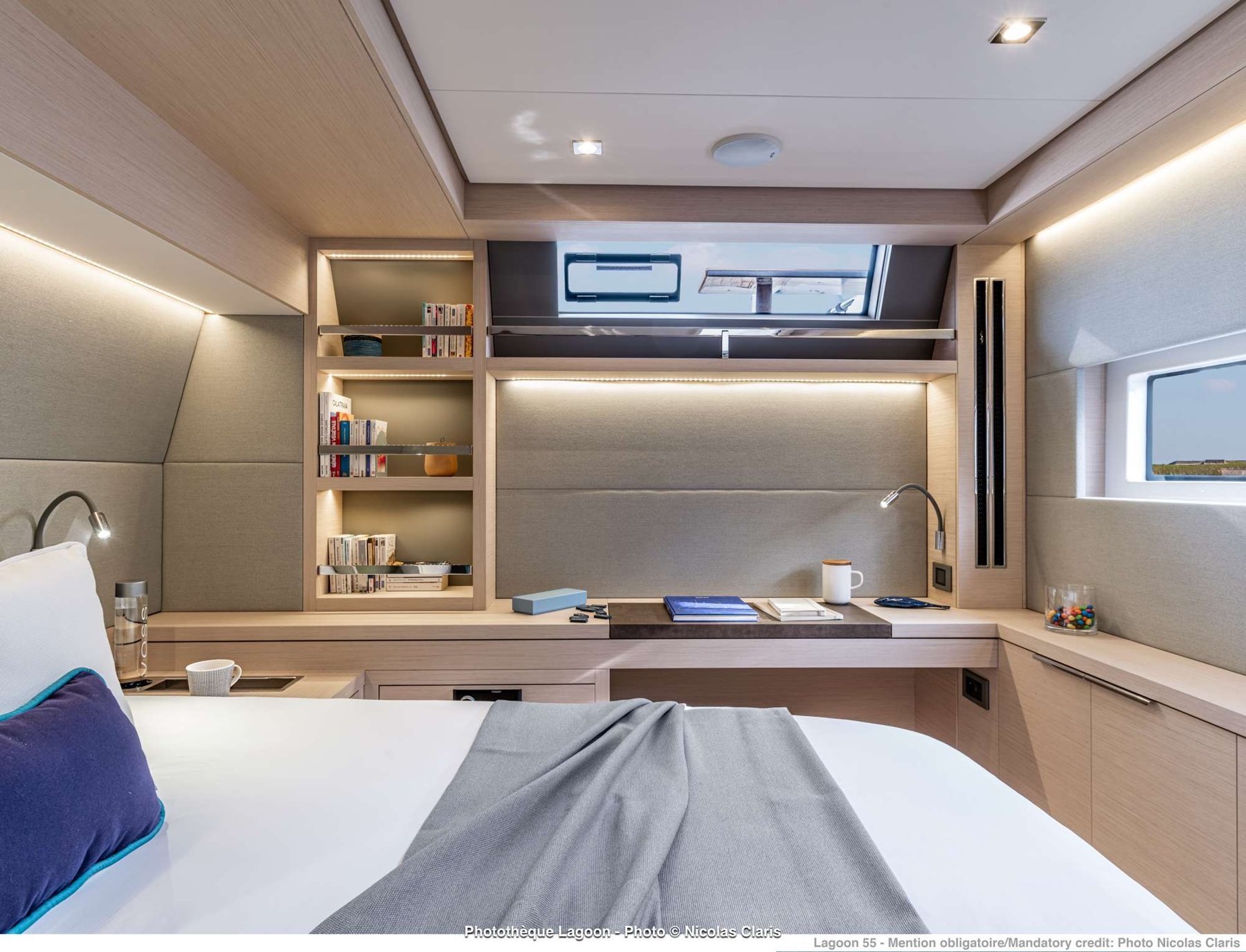 A calm, modern queen cabin aboard the Lagoon 55