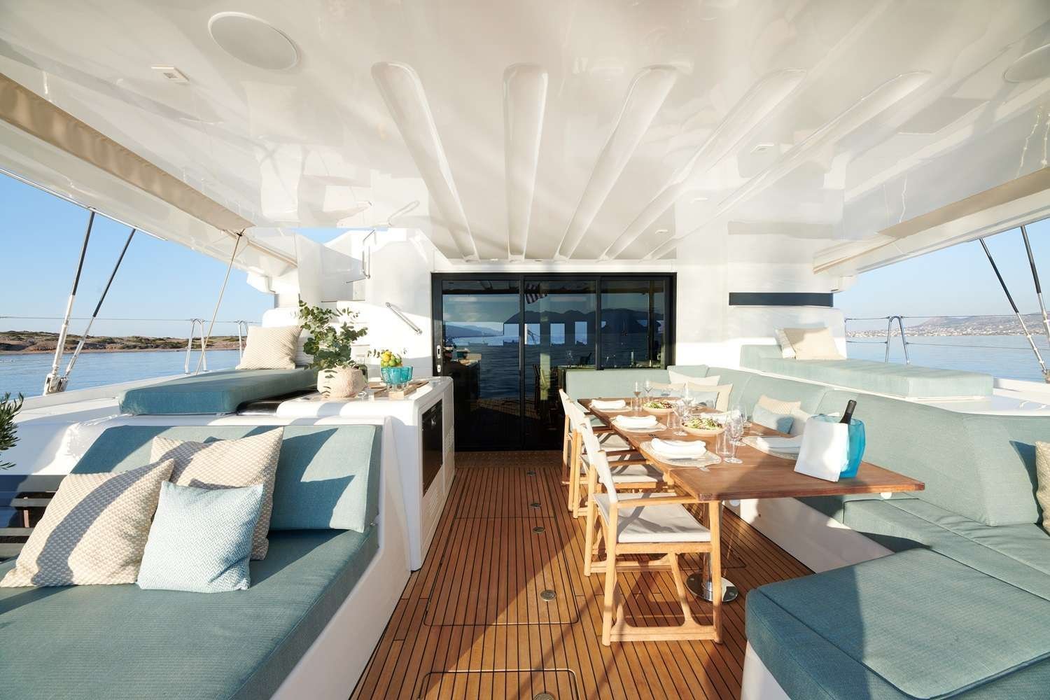 The shaded outdoor dining and lounge deck aboard Seven Seas